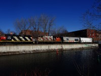 CN 500 is paralleling the recently thawed Lachine Canal as it shoves grain cars towards Ardent Mills.
