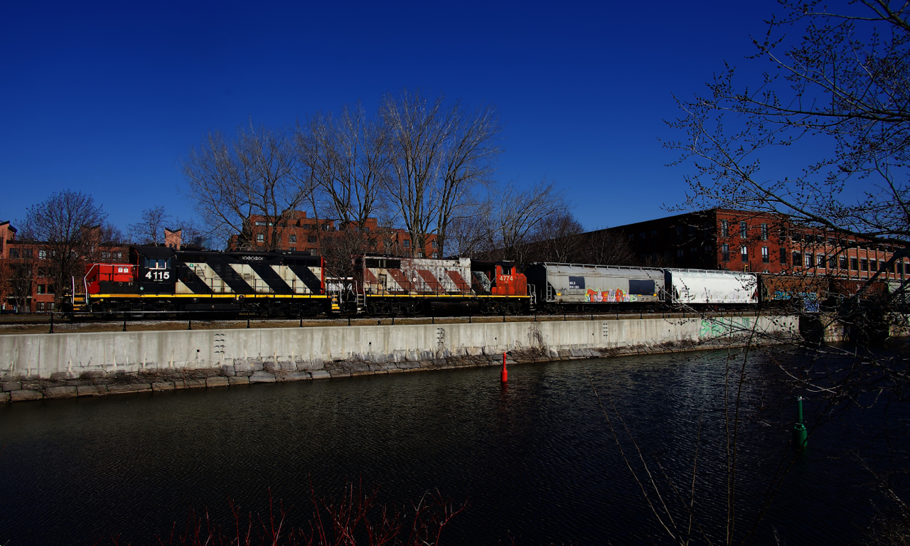 CN 500 is paralleling the recently thawed Lachine Canal as it shoves grain cars towards Ardent Mills.