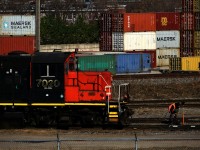 A crewmember throws a switch as the Pointe St-Charles Switcher works the yard. 