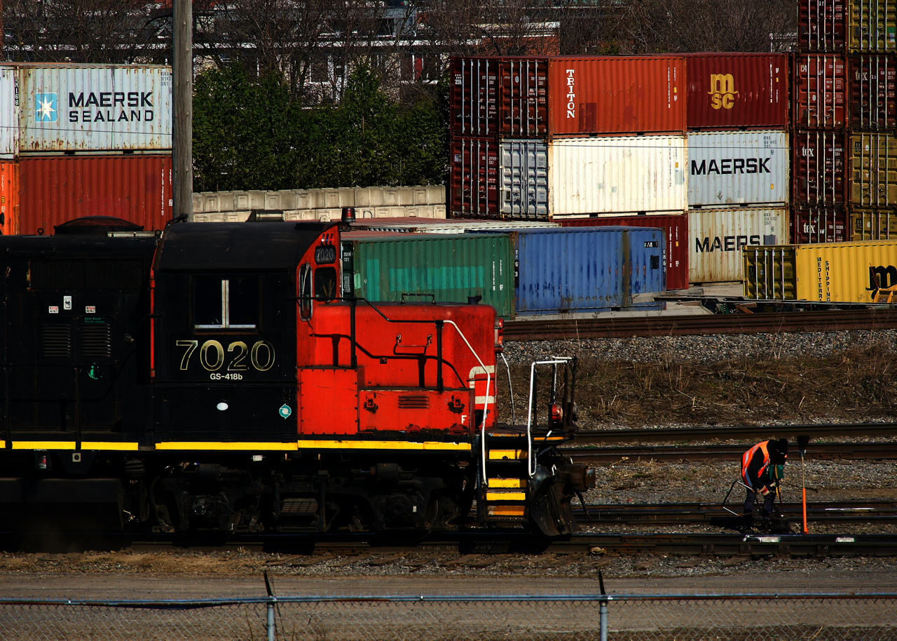 A crewmember throws a switch as the Pointe St-Charles Switcher works the yard.