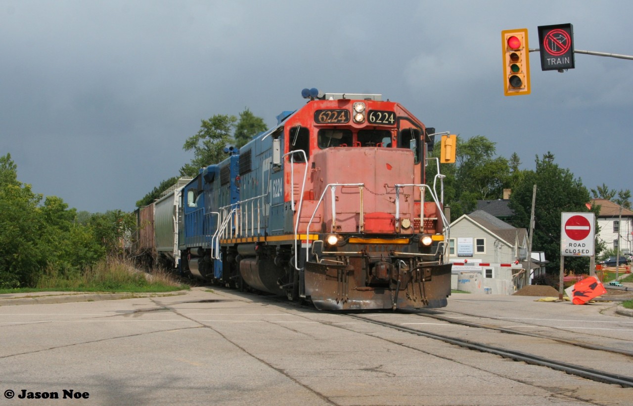 CN L568 with GTW 6224 is barely staying ahead of a fast moving storm as it heads through the town of Baden, Ontario on the CN Guelph Subdivision westbound to Stratford, Ontario.