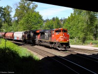 CN SD70M-2 8868 leads CN 834 passed Braid Junction in New Westminster, BC. 