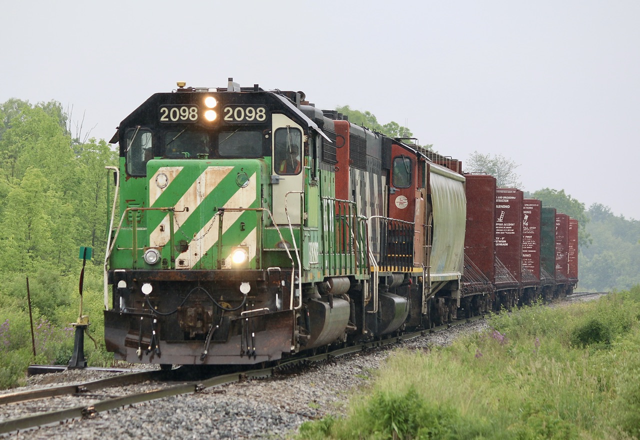 Well it seemed like a good idea at the time. Unfortunately the weather and traffic complicated things to the point I only got it in one spot but at least the delays had given the train enough time to switch ends so the BNSF was leading back home. Here the job from Brantford has already run to Hagersville and is now slowing to work the gypsum board plant outside of town before continuing on to Brantford. I think it has been about 20 years since I shot a GP38 in BN colours, and it definitely wasn’t on a local on CN. Certainly a nice sight in any weather.