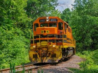 On June 11, 2023, QG 503 returned from the Trois-Rivières Subdivision where it served various customers. He is waiting here for his signal to enter the CPKC Parc Subdivison, which allowed me to take a nice shot in the forest, where the bike path meets the railway line!