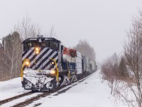 After 2 hours work at the industrial park in Saint-Lambert-de-Lauzon QC, CFS has 12 cars bound for interchange in CN's Joffre yard (Levis QC). They roll through a small rural Quebec town where a friendly local questioned my presence with the camera by the tracks in her little town. CFS 2044 and 2047 are Ex OSR nee BCOL M420Ws that I've been interested in shooting for years. This short chase definitely satisfied those desires. 