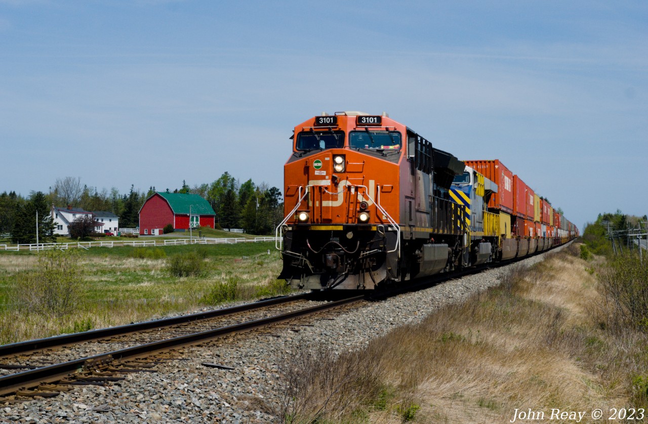 Seen here is the head-end of CN Z120 on May 31st 2023, at Brookfield NS on the Bedford sub with CN 3101 and CN (ex-CREX) 2761 and 534 axles (DPU CN 3020 is mid-train.) This was part of a day out with Halifax area railfan Geoff Doane where we chased this train from the New Brunswick border close to 140 km to south of Truro. In that distance we shot this train six times then had lunch in Truro and lucked into an encounter with CBNS train 305 arriving in the yard there. This was our final location for Z120, about 2 miles north of the Canada Cement spur.