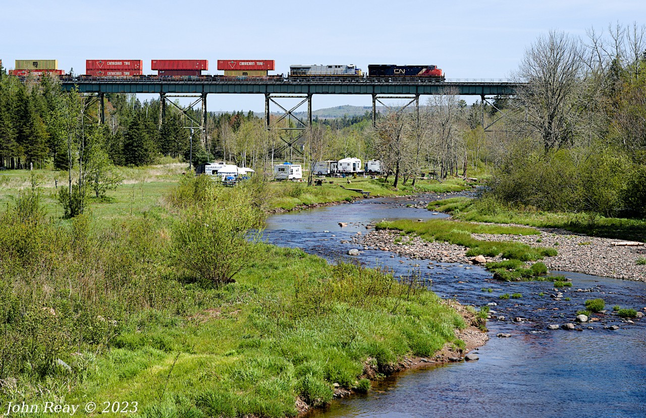 This location has long been on my bucket list. The picturesque trestle over the Folly River at East Mines NS about 14 rail miles west of Truro NS. Seen here is the head-end of CN Z120 on May 31st 2023, with CN 3101 and CN (ex-CREX) 2761 and 534 axles (DPU CN 3020 is mid-train.) This was part of a day out with Halifax area railfan Geoff Doane where we chased this train from the New Brunswick border close to 140 km to south of Truro. In that distance we shot this train six times then had lunch in Truro and lucked into an encounter with CBNS train 305 arriving in the yard there, and finally shot CN L507 five times starting at this trestle all the way to Painsec Junction just a few kms short of Moncton NB.