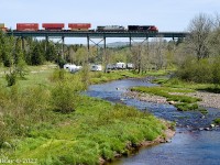 This location has long been on my bucket list. The picturesque trestle over the Folly River at East Mines NS about 14 rail miles west of Truro NS. Seen here is the head-end of CN Z120 on May 31st 2023, with CN 3101 and CN (ex-CREX) 2761 and 534 axles (DPU CN 3020 is mid-train.) This was part of a day out with Halifax area railfan Geoff Doane where we chased this train from the New Brunswick border close to 140 km to south of Truro. In that distance we shot this train six times then had lunch in Truro and lucked into an encounter with CBNS train 305 arriving in the yard there, and finally shot CN L507 five times all the way to Painsec Junction just a few kms short of Moncton NB.