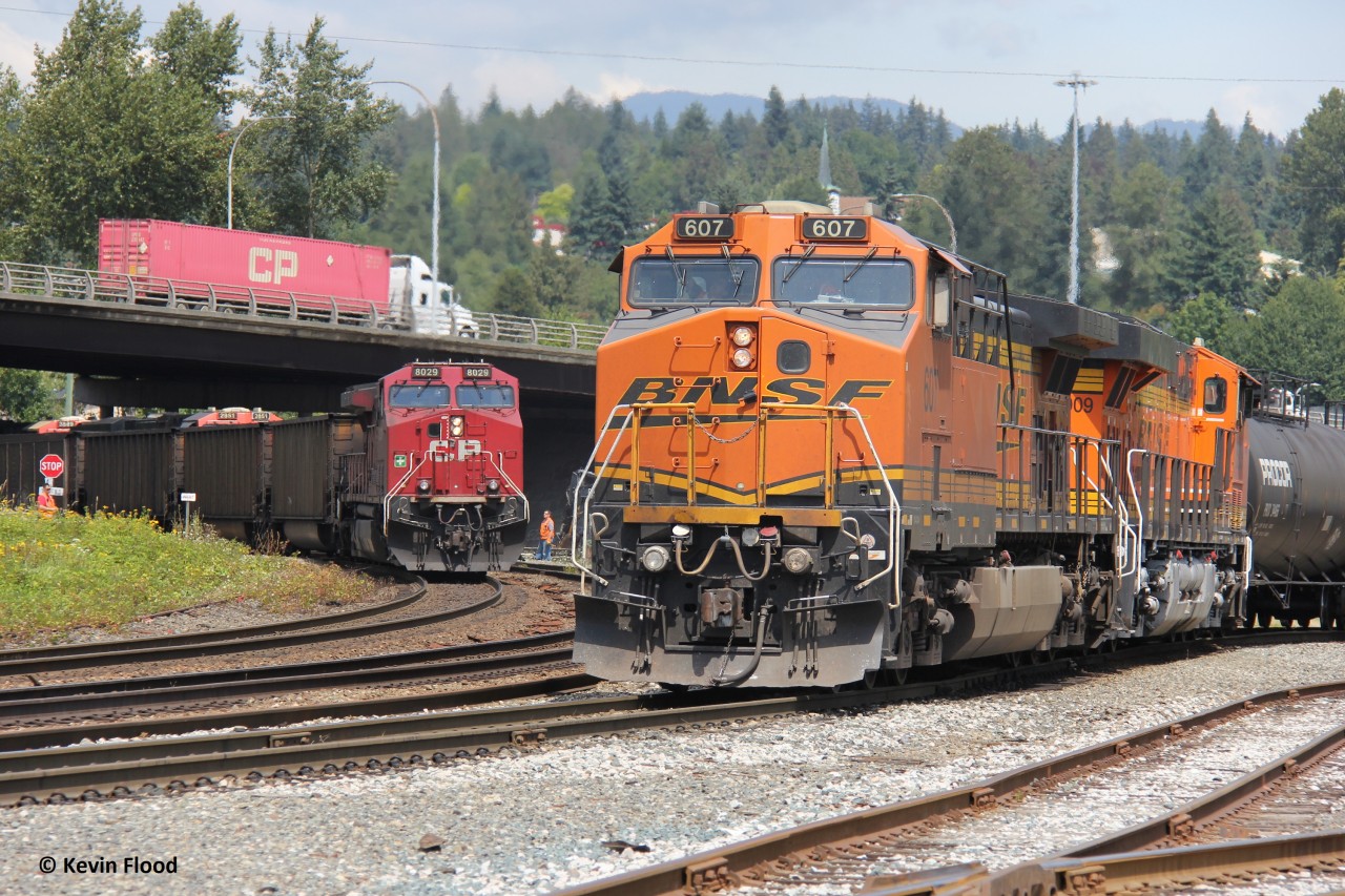 Busy moment at Braid Jct. BNSF 607-BNSF 8009 wait for their turn to cross the Fraser River into Brownsville Yard in Surrey. Meanwhile, a CPKC coal train heads west with CP 8029 as a DPU (in the typical 1-1-1 GE setup) (side note: it is very rare to have power other than a CP GE on these coal movements). The BNSF will still need to wait for a northbound/westbound Amtrak train and a CN potash train (units visible above the CP coal cars) before taking the bridge.