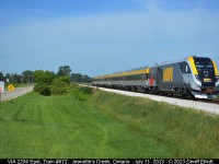 The future is coming quickly despite the sign that says "Caution.  Slow moving vehicles".  VIA 2204, one of the new Siemen's train sets, heads east on the VIA Chatham Subdivision during another test run on July 11th, 2023.  Soon these will be the 'norm' on the Toronto/Windsor corridor displacing all the P42's and F40's that we've been accustomed to for so many years.   Get your shots of the old power and consists before these take over forever.....