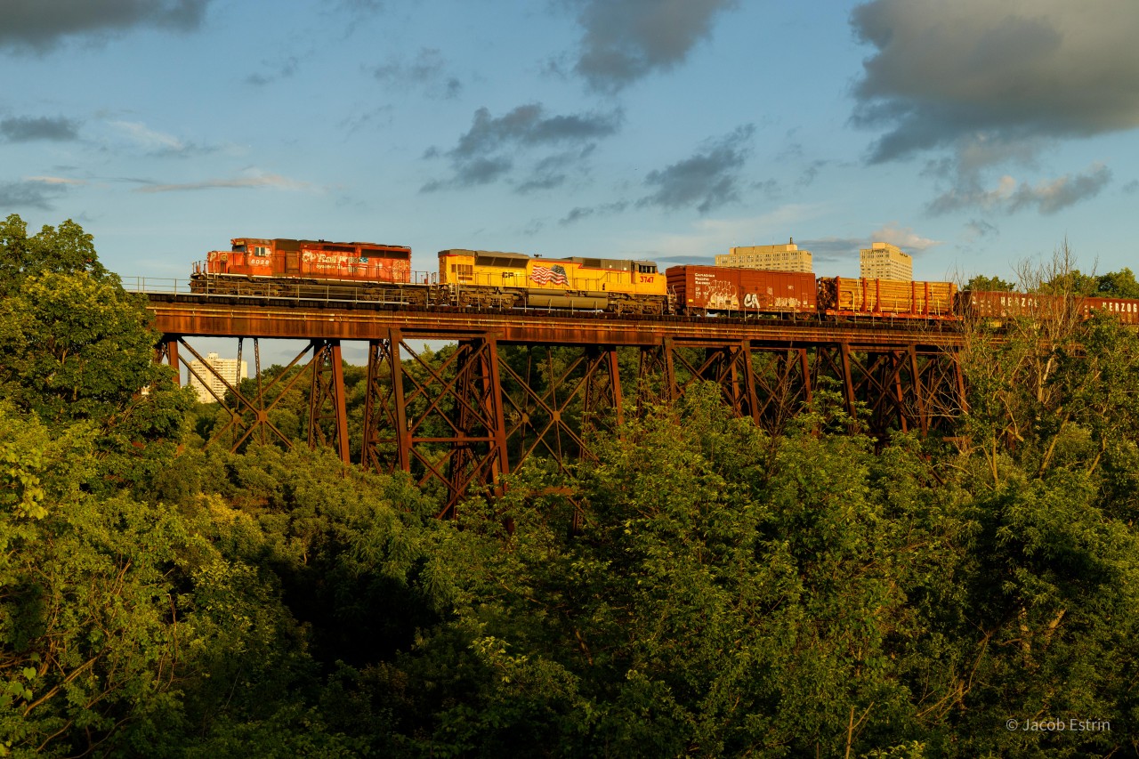 CP 6028 and 3747 are in the lead of GPS-16 as it passes over E.T Seton Park in Toronto's East end.