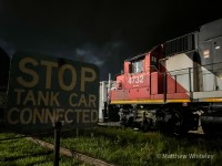 As the clock approaches midnight, CN 566 is seen stopped parallel to Sulco's south lead, where the conductor has just disembarked to throw the split rail derail. Once aligned for the main, the crew would bring their two car train into the yard, where they would spend the next half hour switching and spotting cars before lifting four tank cars (three from Sulco and one from Lanxess) to take back to Kitchener.