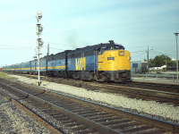 At what was once a favourite location for shooting VIAs, because they stopped at Burlington West's old Freeman station; here is an image of dinner-hour train #79. It usually was a bit smaller than the #75 that was the premier westbound of the day, but this is pretty good as well.  VIA 6780, 6627 waiting out passengers on a really nice early evening many years ago.  The 6780; she has been preserved, still running on the Cuyahoga Valley based in Independence, Ohio.