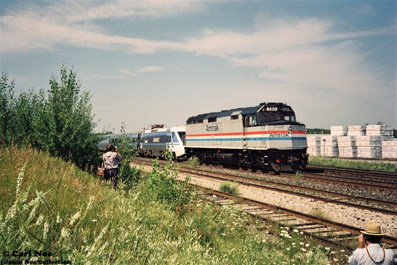 In summer 1993, my first trip to CP Guelph Jct. ironically wasn’t to photograph a CP train, but rather a promotional passenger train set. So the story goes, in July of that year CP sponsored the tour of the X2000, which was a Swedish State Railways train set built by Asea Brown Boveri (ABB) on their lines in Quebec and Ontario. The week-long promotional tour of the two provinces then followed several months of testing and display of the train in the United States by Amtrak. The Toronto portion of the tour was followed by two X2000 excursions to Guelph Junction and return via the Galt Subdivision.
I forget exactly how we found out about it, which was likely through word of mouth at the time, but my dad, myself and a friend arrived at Guelph Jct. ahead of the train’s arrival and immediately realized we weren’t the only ones there. Many other railfan’s, the media and everyone else in between were there to take in the event as well as the crew of the CP local to Guelph, which was powered by an RS18u. For a 13-year-old kid just learning how the mainline’s in Southern Ontario worked, there was so much to absorb let along a futuristic passenger train. I snapped many photos on my small Kodak camera of the train that day and in the end only a few really turned out not too bad.

Here the X2000 train is seen paused at Guelph Jct with Amtrak F40-2 380 powering the train on the opposite end as several railfans take their photos of the event.