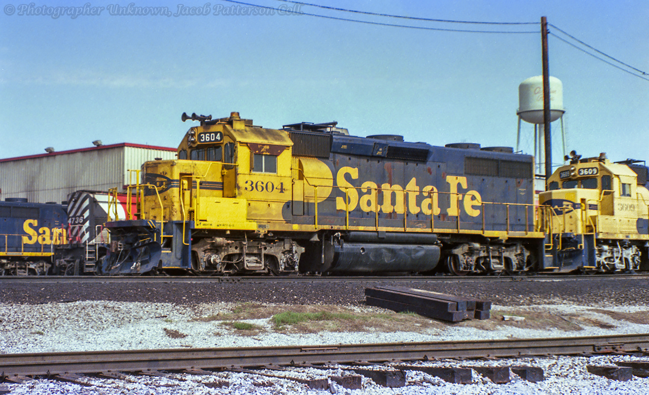 Leased ATSF GP39-2s 3604 and 3609 sit outside CP's Agincourt Diesel shop, coupled with ATSF 3600 further out of frame to the right.  Another ATSF unit on lease can be seen in the background just beyond CP 4736.  A view of some ATSF units in service, taken by Arnold Mooney near Parry Sound can be seen here.This image is part of a set of negatives - both colour and black & white - given to me by Steve Bratina, who had acquired them from a Toronto area train show in the early 2000's.  The seller was "getting out of the hobby" and several rolls of negatives, mainly rosters from the late 1980s at Agincourt, were tossed into the sale.  The seller was also a modeller. If anyone has any ideas who the photographer may have been, please comment below.Original Photographer Unknown, Jacob Patterson Collection Negative.