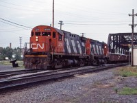 C424s 3214 and 3228 lead a transfer over the Lachine Canal on a summer's evening in 1984. Built in 1966 and 1967, these units were 2 of 18 still active when the 1985 Canadian Trackside Guide was published. Unlike CP which kept many of its C424s into 1998, CN retired or sold all of its C424s by 1989. Note the Canal Bank industrial spur curving off from the Montreal sub to the left in the photo (and also to the right--not visible in the photo).