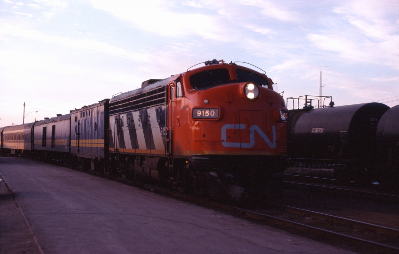 Until the "Pepin cutbacks" in November 1981, the Manitoba towns of Thompson, The Pas, and Dauphin had six day per week train service to and from Winnipeg. Three days per week, train trains to Winnipeg originated in Churchill and in Thompson the other three days per week. This latter train typically ran with an F7Au, an SGU, a baggage car, a buffeteria coach, and a full coach and is seen arriving at the station in The Pas at dusk. By late morning, this train will be in Winnipeg. ("Fun facts": the photographer arrived in The Pas on the tri-weekly Railiner from Saskatoon and missed photographing the tri-weekly mixed from Lynn Lake which had already arrived!)
