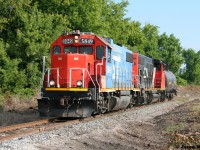 CN L542 with GTW 5849 and CN 4770 approach the recently clear-cut Whitelaw Road crossing on the Fergus Spur as they head to switch Flo-Chem, which is situated along Wellington Road 124 outside Guelph, Ontario.  