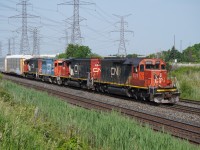 With a cut of autoracks from the Fiat-Chrysler plant, L579 returns back to MacMillan yard with a rare ex-MP SD40-2 in the lead.