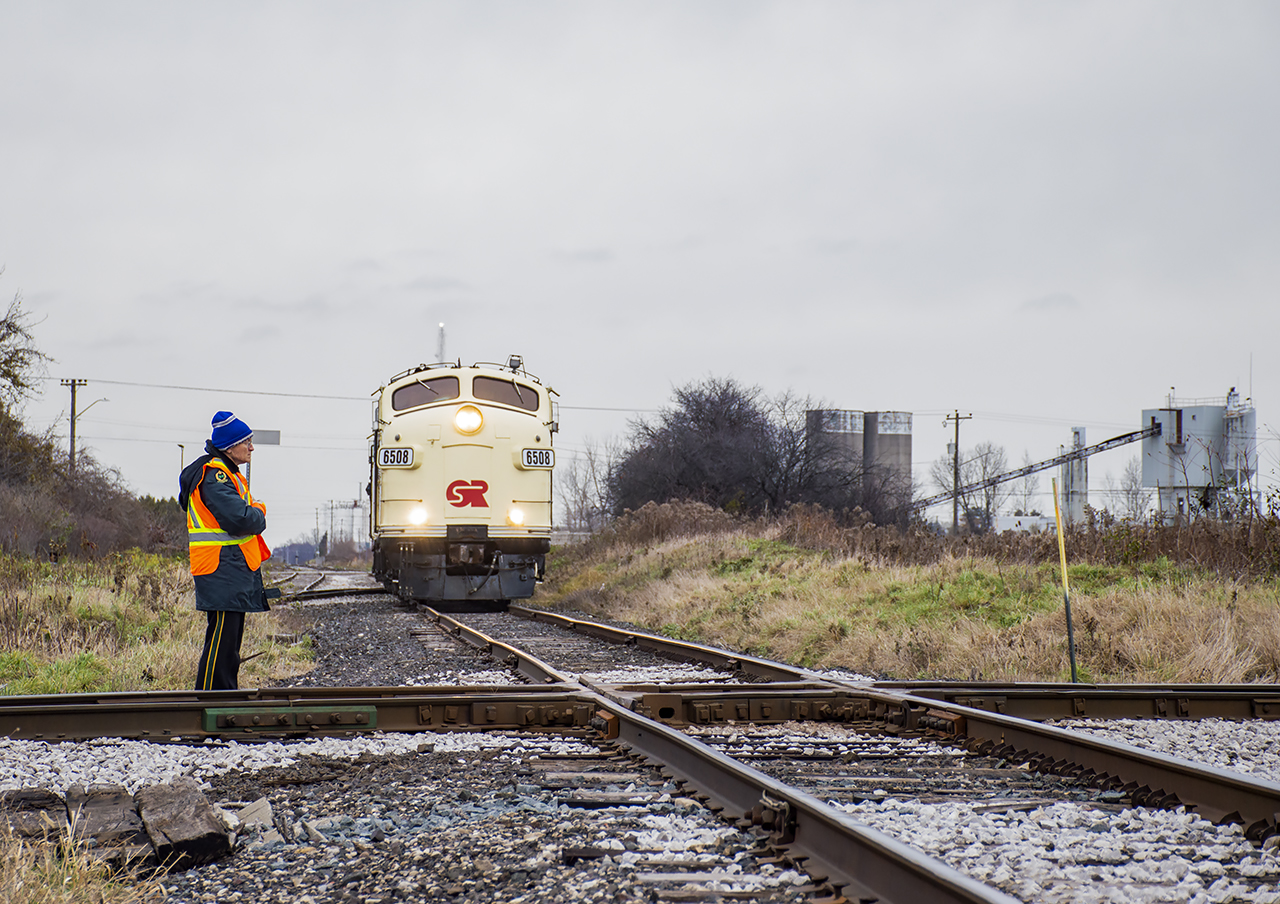 Conductor Flynn protects the crossing of CN's Cayuga Subdivision, giving OSR's business train permission to depart the Wabash Transfer for the end of steel at Talbot Street.