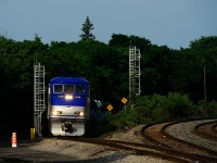 EXO 78 from Candiac is approaching Montreal West tower and station with EXO 1325 and three multilevel cars.