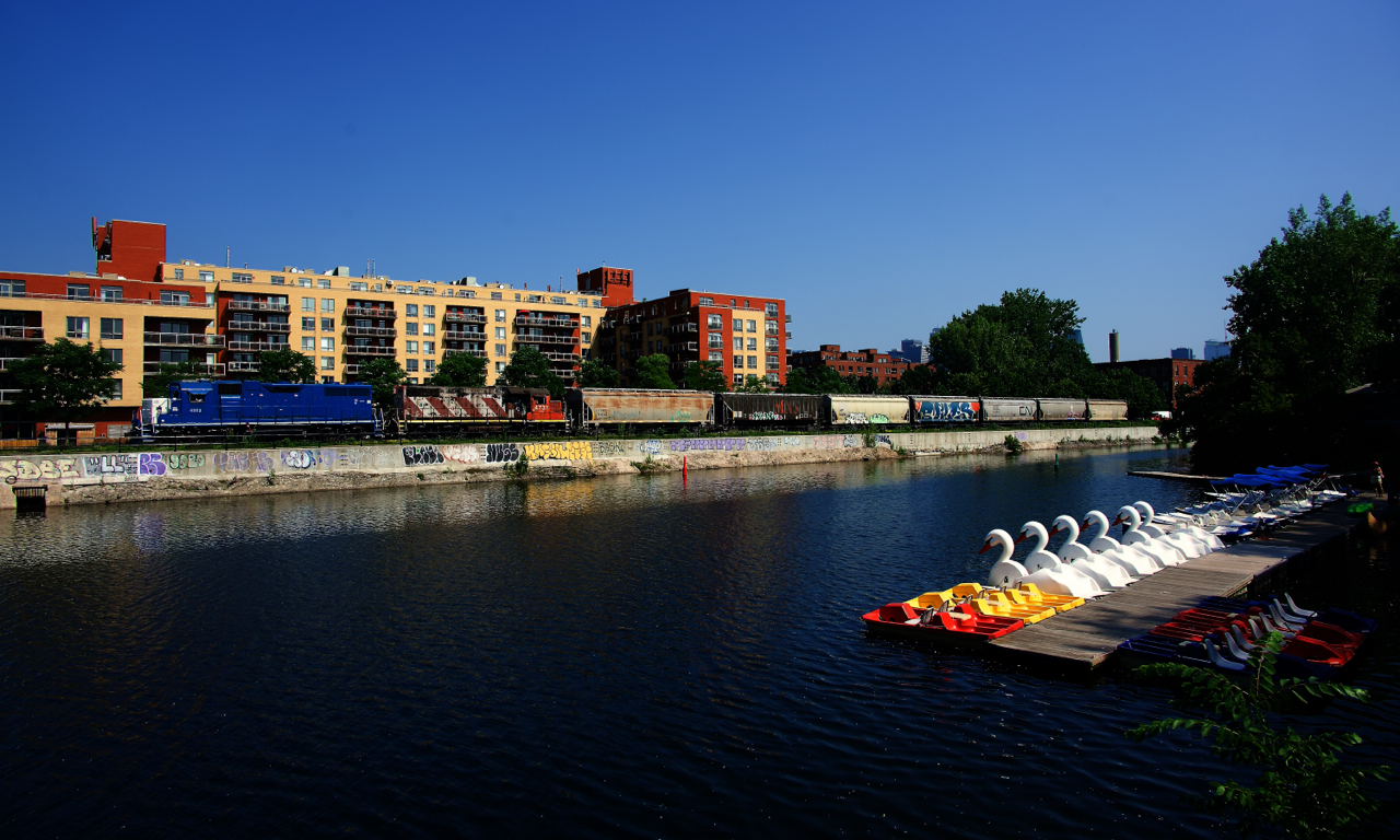 CN 4903 & CN 4731 are shoving seven grain loads towards Ardent Mills on a scorching and humid morning.