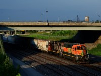 In a surprising development, a number of BNSF Geeps are in local service on CN, apparently repaying horsepower hours. Here BNSF 2302 leads CN 596 as it crosses over from the Freight Track to the North Track at Turcot Ouest with traffic for Taschereau Yard.