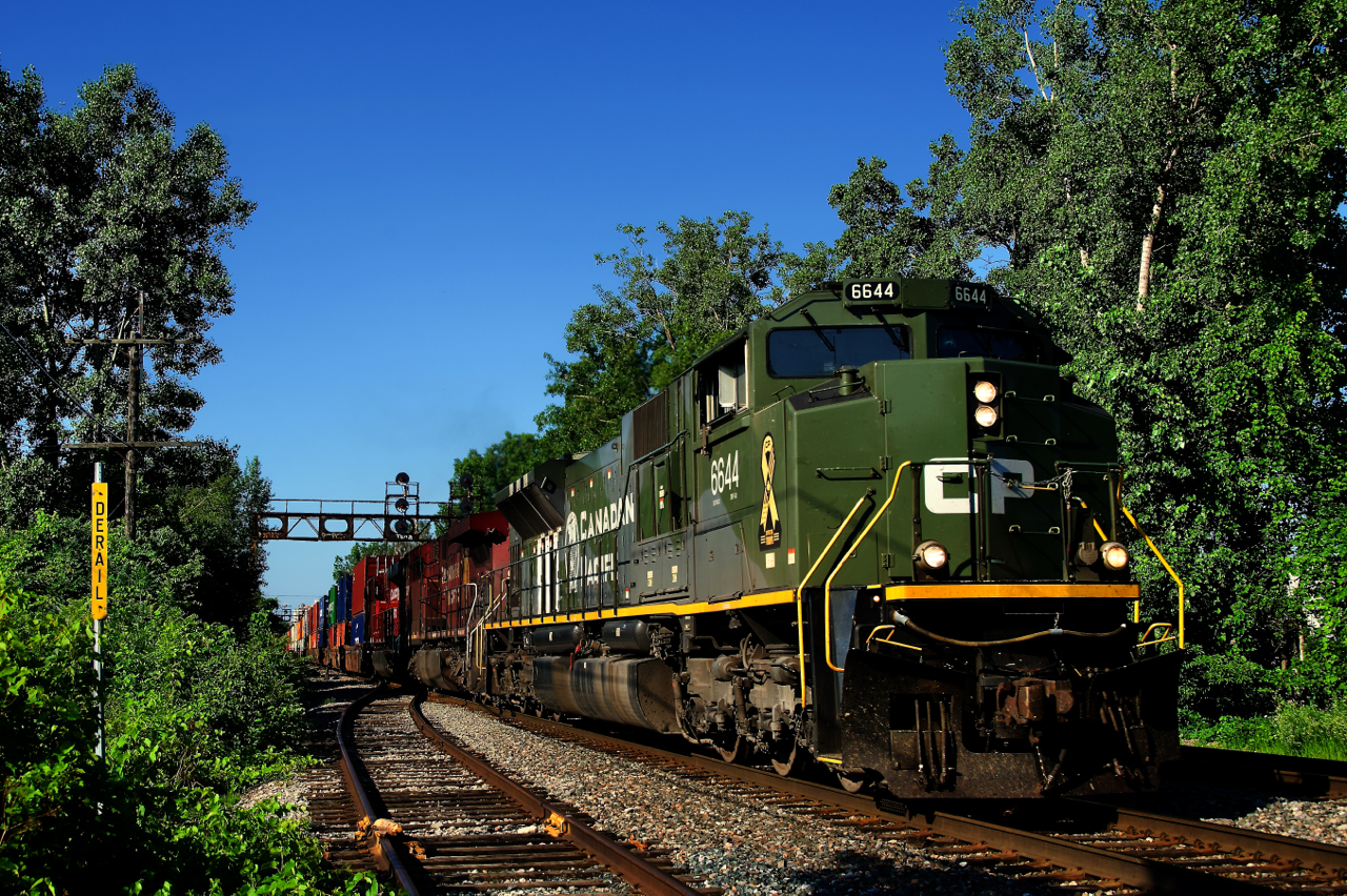 After setting off traffic in St-Luc Yard, CPKC 118 is heading to the Port of Montreal with intermodal traffic and D-Day unit CP 6644 leading a pair of GEs.