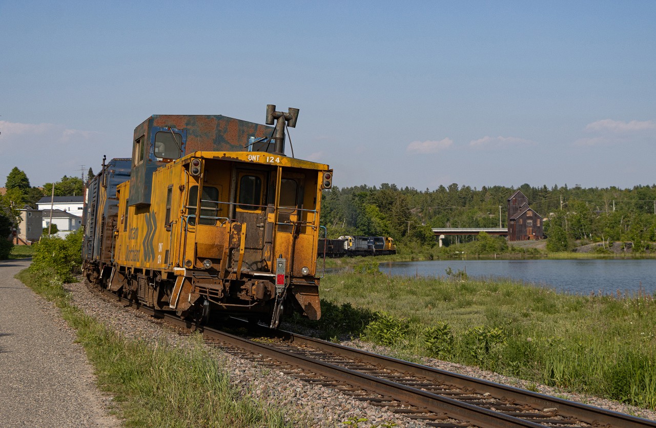The ONR Ditcher #1 heads northbound to Englehart on the Temagami Subdivision through Cobalt, ON at the old mining headframe and around the curve of Cobalt Lake.  The Angus shops-built van on the tail end makes for a nice subject, with the power crawling down the line in the distance.  Cobalt has always been a very unique spot on the ONR that I've always wanted to shoot.  The power of the ditcher would be brought down to North Bay on 214 the following day.