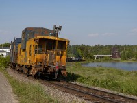 The ONR Ditcher #1 heads northbound to Englehart on the Temagami Subdivision through Cobalt, ON at the old mining headframe and around the curve of Cobalt Lake.  The Angus shops-built van on the tail end makes for a nice subject, with the power crawling down the line in the distance.  Cobalt has always been a very unique spot on the ONR that I've always wanted to shoot.  The power of the ditcher would be brought down to North Bay on 214 the following day.