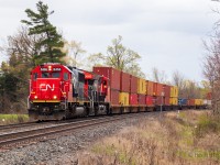 CN SD60s are pretty uncommon in the Greator Toronto Area, and have been for multiple years. CN averages about two every year on the Halton, when they escape local service in the USA. This 148 was power swapped in Flint Michigan, with a SD60/Tevo combo getting put on the hotshot stacker. As a result, a bunch of railfans made their way to the tracks for it. CN 5456 and CN 3060 approach SNS Stewarttown with lights all the way to Brampton. 