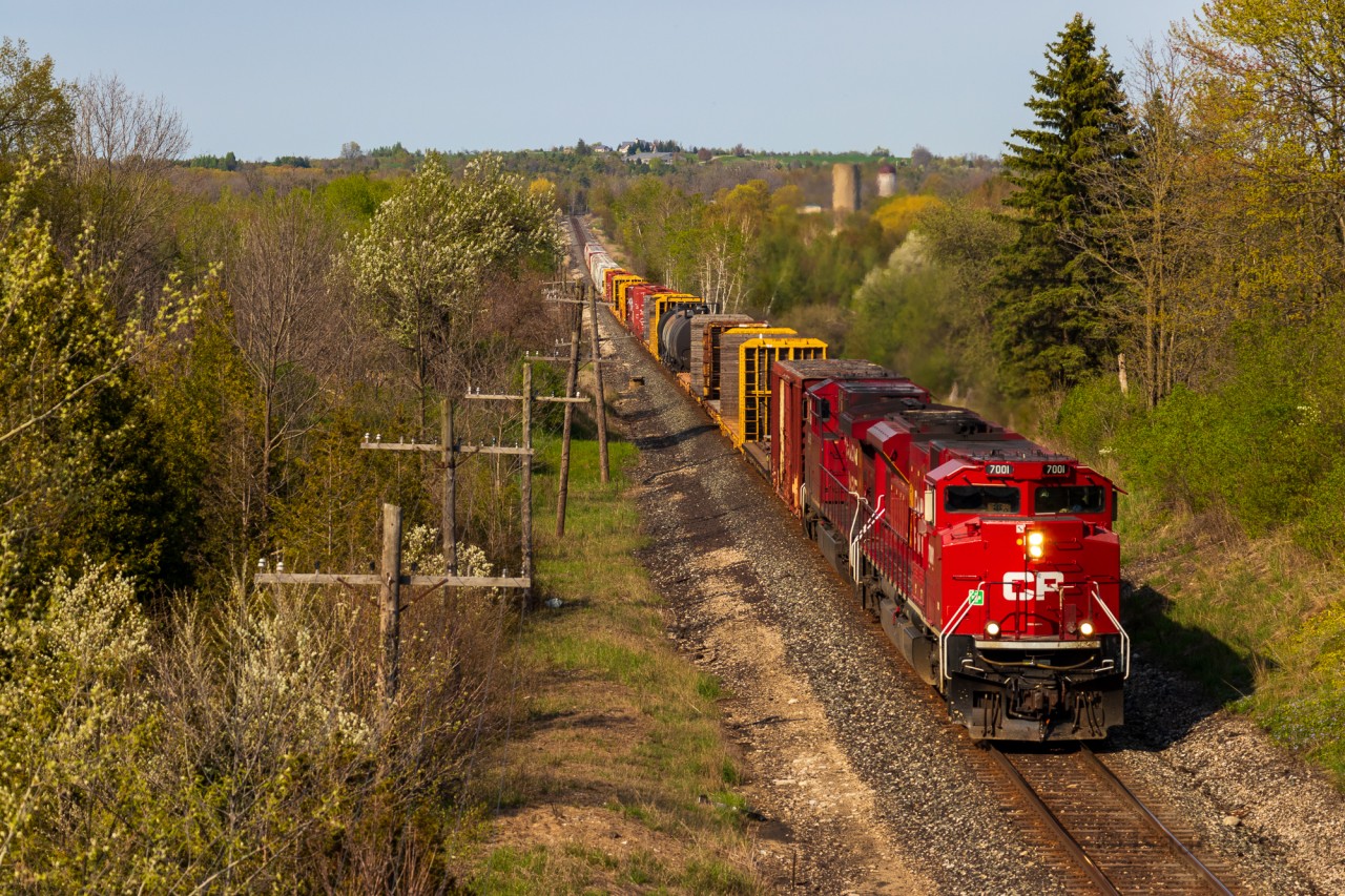 CP 239 blasts through Puslinch after clearing Guelph Jct with SD70ACu CP 7001 leading CP 8035 and around 40 cars for London. CP 239 (Ex 255) is by far the fastest road train I consistently see, with them nearly always going trackspeed due to their short & light train.