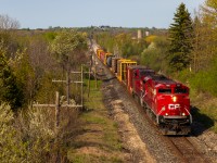 CP 239 blasts through Puslinch after clearing Guelph Jct with SD70ACu CP 7001 leading CP 8035 and around 40 cars for London. CP 239 (Ex 255) is by far the fastest road train I consistently see, with them nearly always going trackspeed due to their short & light train. 