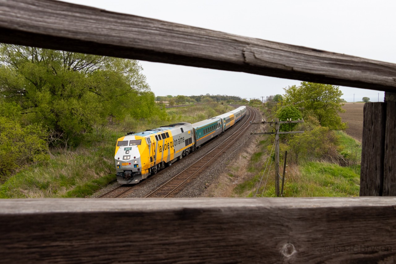 VIA 63 flies by the famous Lovekin wooden bridge with a 5-pack of LRC coaches bound for Toronto. Leading is P42DC 920, the final one in VIAs order.