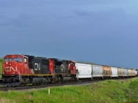 Waiting on the mainline near Fabyan, Alberta just east of the Battle River Railway Trestle (also known as the Fabyan Trestle Bridge) are CN 5756 and CN 8823.