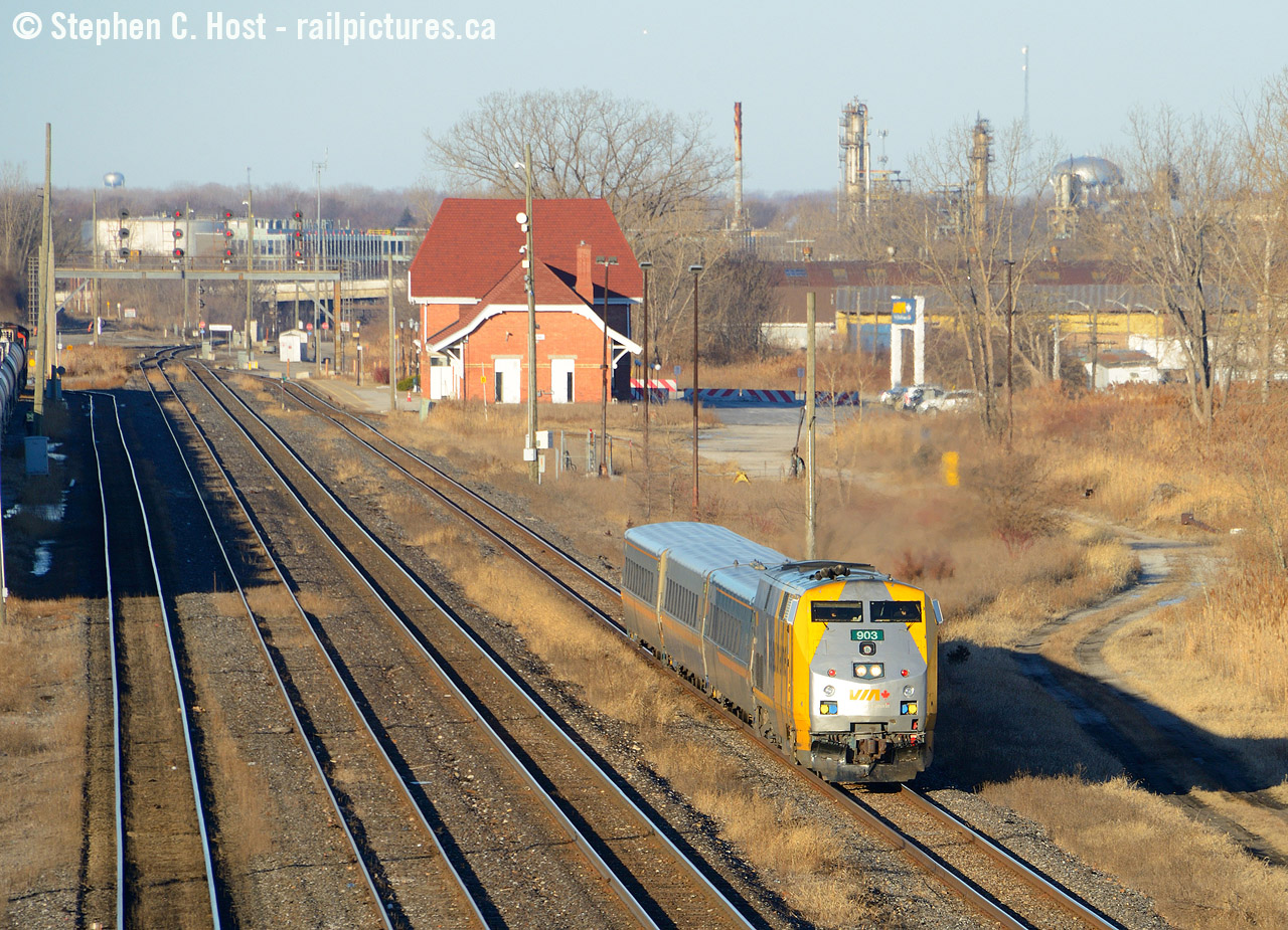 Departing the Sarnia VIA station, #84 begins its journey to Toronto on a nice blue sky sunny winter day. Note in the background the water towers of Port Huron, Michigan in the distance. Later that day I'd shoot CSX L306 (formerly D711) from the exact opposite direction, at the exact opposite sun angle (Note: External website) from the Port Huron side looking toward Canada. I usually cross the border for gas and groceries, and bring my camera just in case, this was very much worth it considering what I photographed from the Canadian side. This comparison also made it into a magazine!