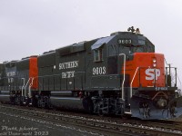 Brand new Southern Pacific 9603 and 9602, part of the first GP60 locomotive order placed (20 units for SP), sit on the "test track" outside the GMD London assembly plant. The new GP60 units were EMD's latest 4-axle freight locomotive design, featuring the turbocharged 3800hp 16-710G engine and microprocessor-controlled technology.
<br><br>
SP placed their first order in late 1987 (9600-9619, built 1987-88), and followed up with later orders for an eventual total of 195 units split between them and subsidiary St. Louis Southwestern (SSW 9620-9714 and SP 9715-9794), all built at GMD London. Of note, only the first order featured nose-mounted headlights. Most of SP/SSW's GP60 fleet is still in operation with the Union Pacific.
<br><br>
<i>Ian Platt photo, Dan Dell'Unto collection slide.</i>