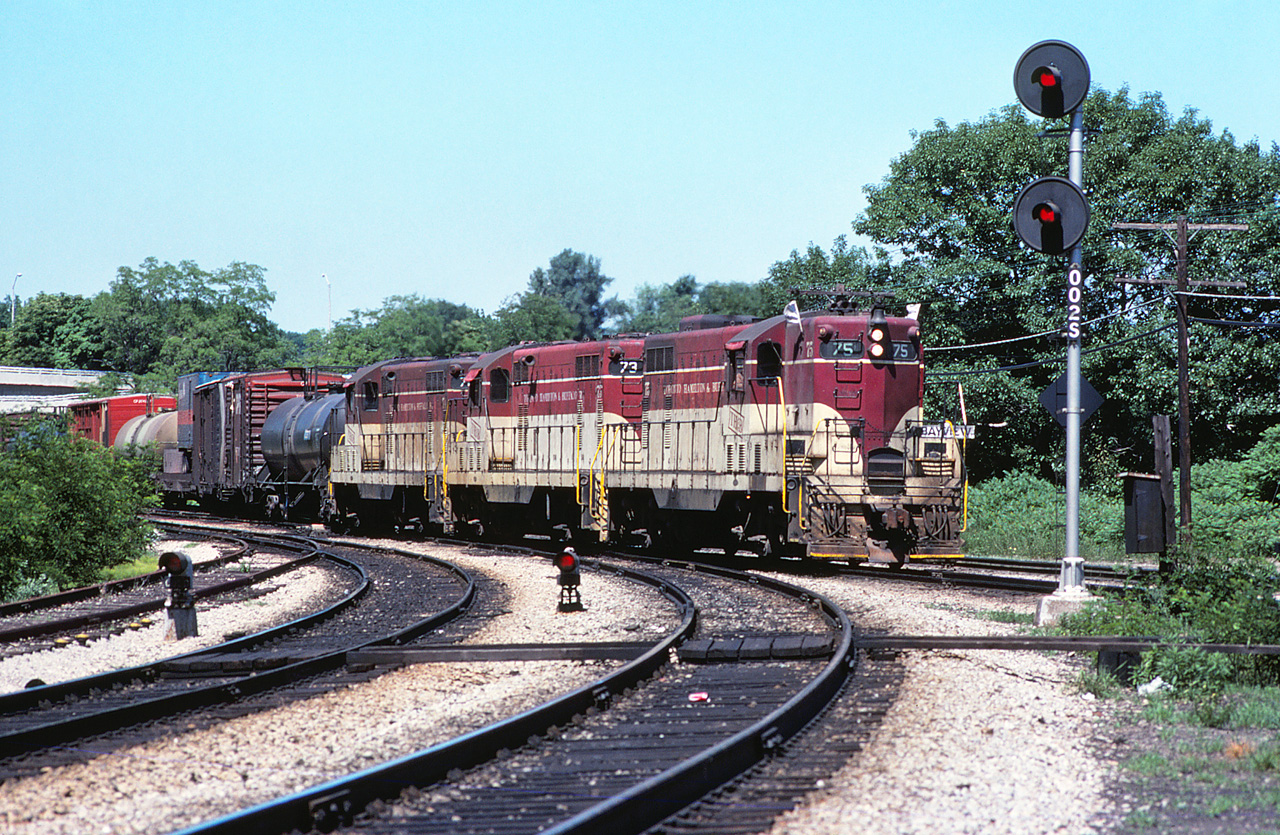 Happy Bayview Day to those RP.ca contributors close enough to attend and dedicated enough to deal with the weather. At some point I'll need to make it to one of these.

No one caught this today - in what was once a regular scene, here are TH&B 75, 73, and 74 leading the "Starlite", a.k.a. the CP Hamilton Turn from Agincourt.