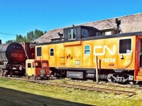 CN caboose 79538 (manufactured in 1972) and CN tank car 990887 (manufactured in 1930) outside the Kneehill Historical Museum, Three Hills, Alberta.