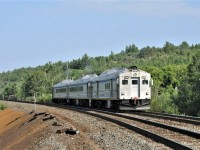 With an on-time departure from Sudbury, VIA train 185 heads into the wilderness west of Sudbury, Ontario on July 4th, 2023. The train has 6217 leading, 6219 in the middle, and 6250 bringing up the rear.