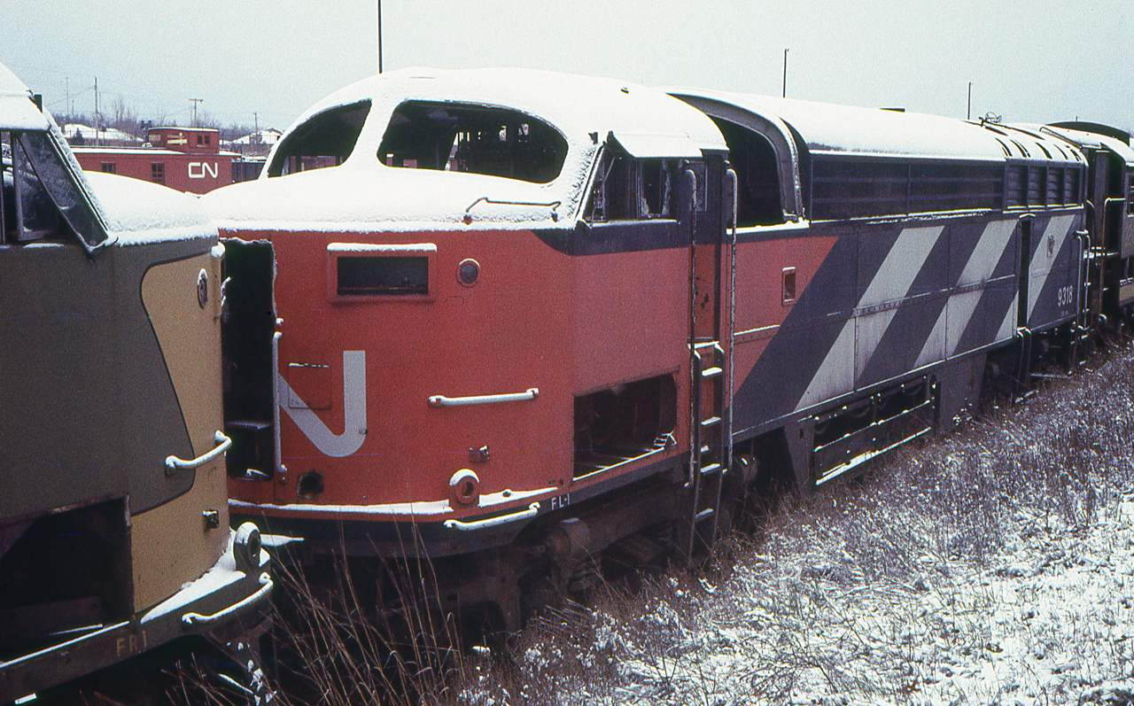 Sometime only the remains are left. The stripped hulk of CN 9318 is in CN's Reclamation Yard in London, Ontario on November 30, 1968.
She was a CLC CFA16-4.