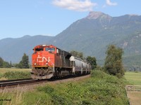 A westbound grain train is pictured hustling towards CN Thornton Yard in Surrey (and elsewhere in the Vancouver area possibly). It is pictured on the approach to Annis Rd. just east of Chilliwack, BC (Mile 66.3 of the CN Yale Sub). We had a car this particular weekend, so a nice Sunday drive into the mountains a bit was in order. I’m appreciative that my wife and daughter were so patient as I followed these two mainlines paralleling each other on either sides of the Fraser River. All trains I caught were the following: CN power with a solo engine up front and as a rear DPU…didn’t catch a single train with CPKC power (even though I followed the CPKC mainline). It appears CN has trackage rights on the CPKC mainline. There is another bridge called the Mission Bridge in Mission, BC where CN can return to CN rails and vice versa. I don’t know. I still don’t have the Vancouver area railway operations and lines figured out! It is way more complex than southern Ontario.