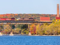 A late morning westbound crosses the Trent River with CP 8051 and 7018 on the front end.
