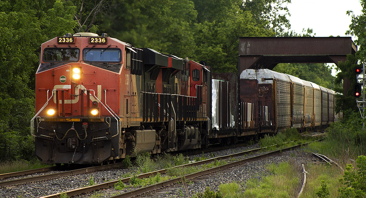 When the child is away, the Dad gets to play! This was the first time in a long time, I was able to get out and enjoy a hobby that doesn't get much attention these days. With my wife working nights, and my daughter at my in-laws - I found myself with some time on my hands. After trying other nights through the week, I had little to no success in photographing a train. However, this was all about to change this weekend. Shot on a humid Friday night, 438 roars through name sign "Chatham East", past the site of the old train order office that once stood - and across the bridge on route to London.