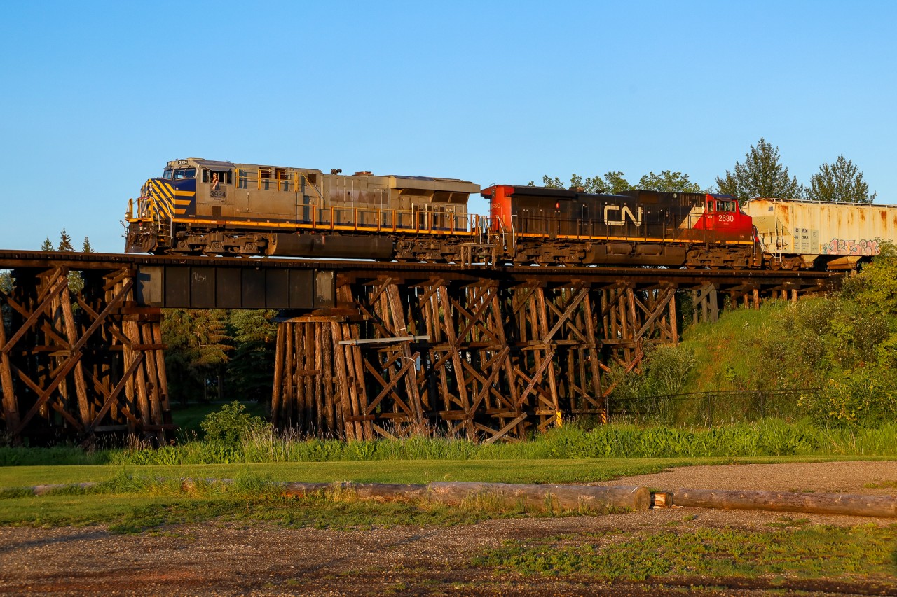 Edmonton to Whitecourt L 51551 28 crosses the first of many large, wooden trestles on the Sangudo Subdivision, as they depart St. Albert.