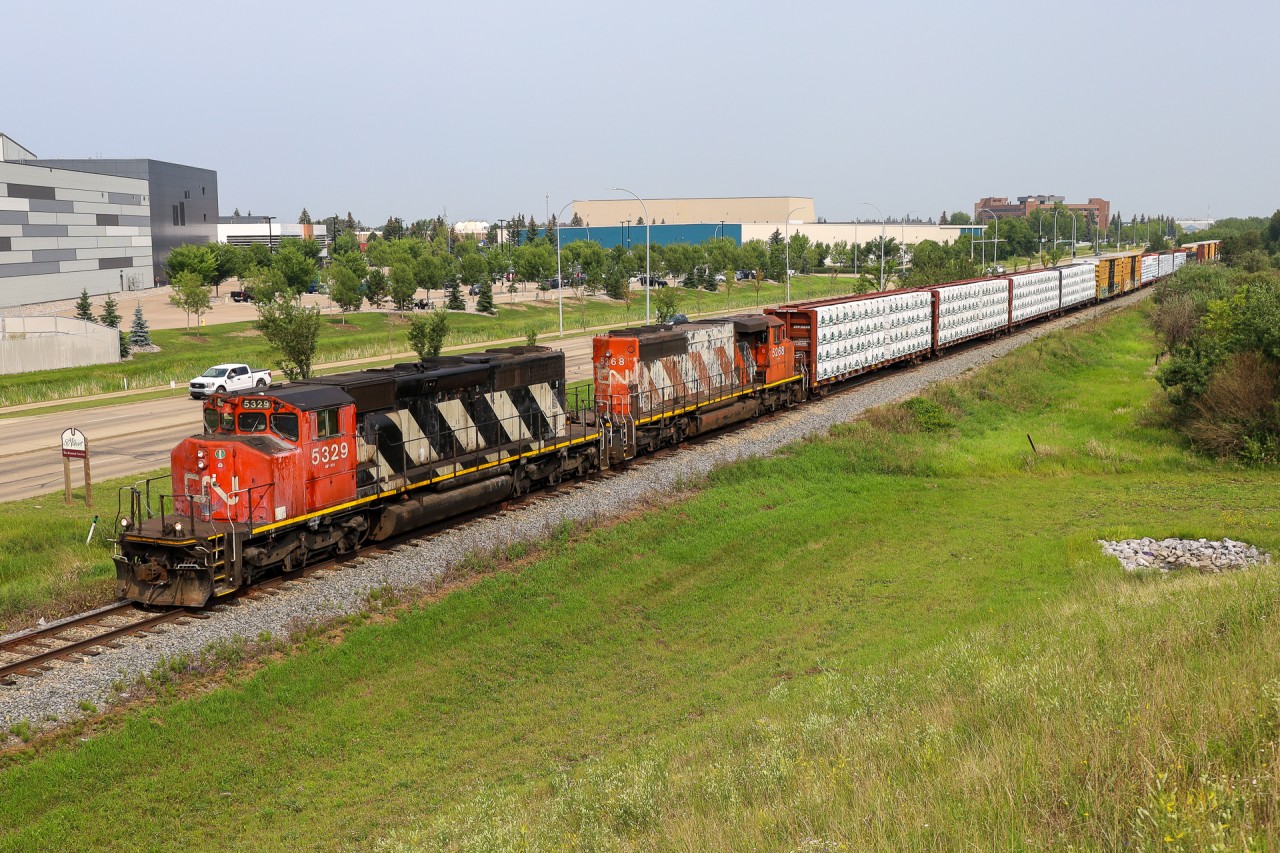 A 41851 16 from the Peace River region of Alberta, exits St. Albert and enters Edmonton with a pair of SD40-2Ws