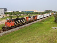 A 41851 16 from the Peace River region of Alberta, exits St. Albert and enters Edmonton with a pair of SD40-2Ws