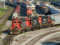 In keeping with the three GP9RM series of photos posted recently, here 4116, 7052 and 7016 bring-out a cut of cars as CN 2978 and 3162 set-off cars in Stuart Street Yard in Hamilton, Ontario. I didn’t catch the train ID for them, (possibly L570), however after completing their work, they departed the yard and went light-power back down the Oakville Subdivision. 