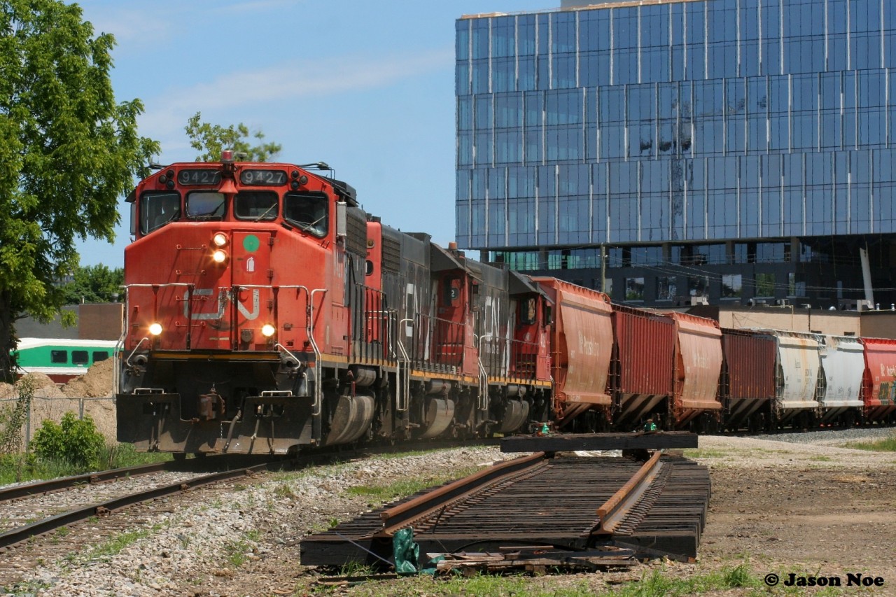 Against the ever changing skyline of downtown Kitchener, CN L568 shoves off the Huron Park Spur with 9427, 7521 and 4732. Once clear of the spur, L568 would head west to Stratford on the Guelph Subdivision and points beyond. June 19, 2022.