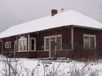 When viewing <b><a href="http://www.railpictures.ca/?attachment_id=34107"> Arnold Mooney's photo of former CN Sutton station</a></b>, I was reminded of my only trip to the area back during the Holiday season of 2005. I couldn't help but to remember how I was nearly 20 years younger then, and how frigid of a day it was with storm clouds moving in fast. To say the least, it was a winter wonderland driving up. But, also present day - another timeless attempt for a time machine photo. Seems like this old building, no matter where it lies when Arnold shot it in 1976 or in 2005, that some sort of foliage seems to be growing around the station. Difficult angle, as my feet were frozen by this point after breaking through many icy puddles that were water and mud. But, the building itself while in much better shape than in 1976, did show some maintenance was already required in 2005. Still, the old station looked great as it rests in retirement now at the Georgina Museum in Keswick.  